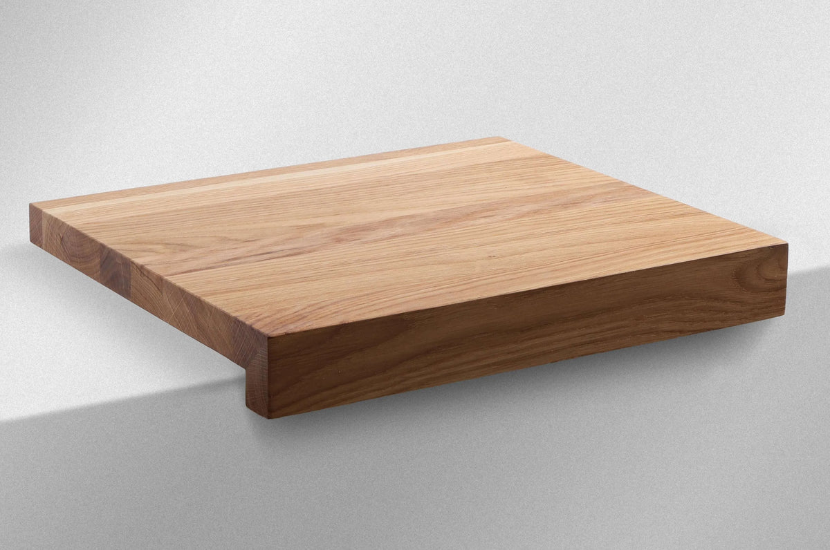 Oak Edge Cutting Board shown from the side, highlighting its table-edge hook design
