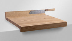 Oak Edge Cutting Board with a chef's knife resting on the surface, showing the table-edge hook